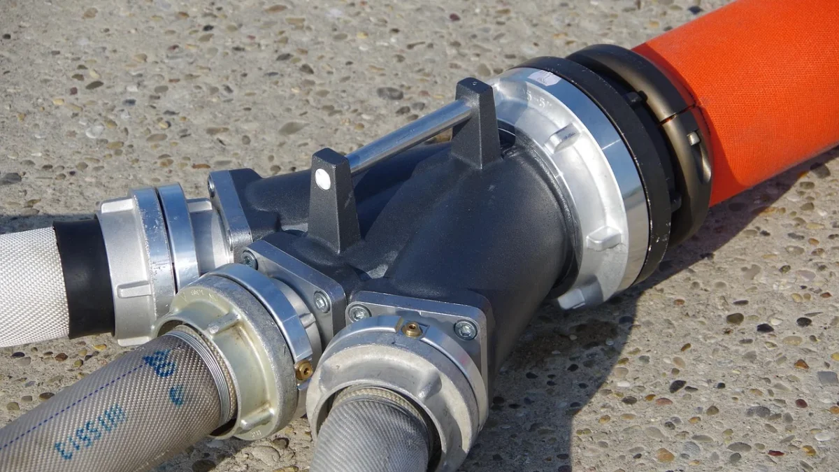 Brass hose bib vacuum breaker screwed onto an outdoor garden faucet