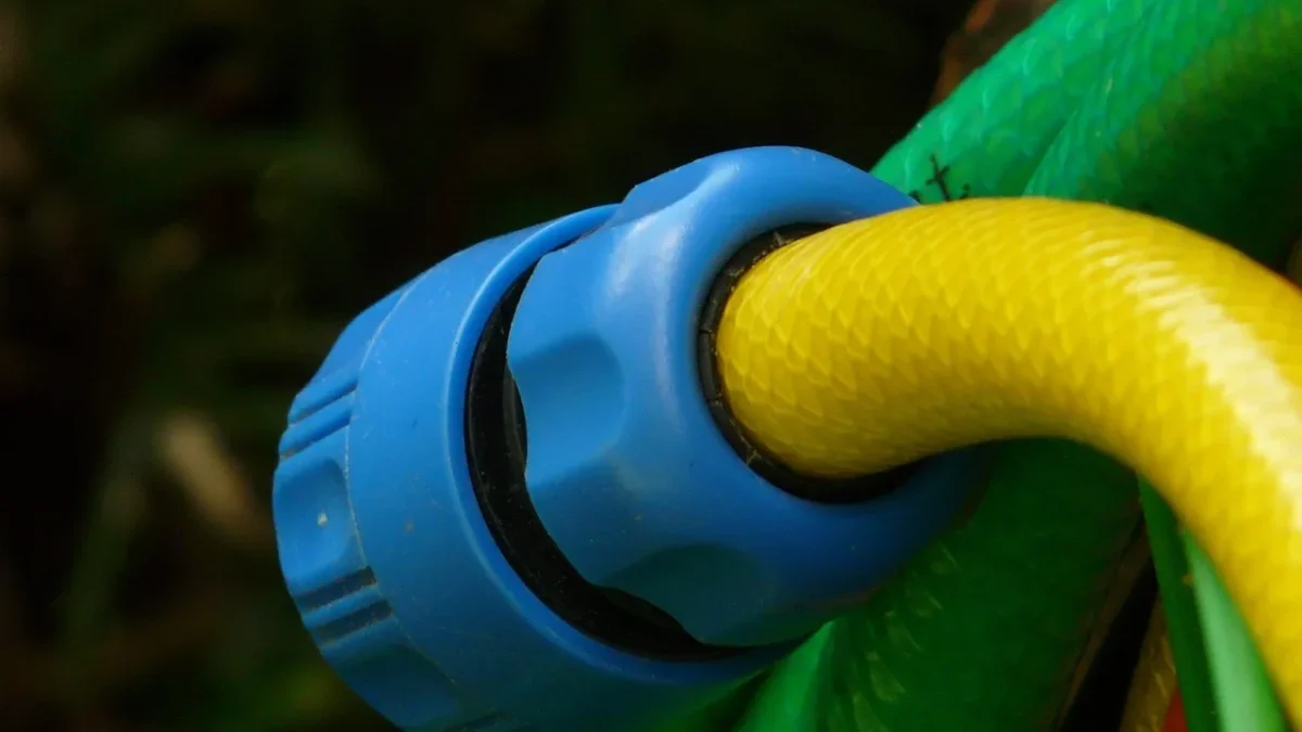 Close-up of garden hose threads on an outdoor faucet ready for a drip adapter