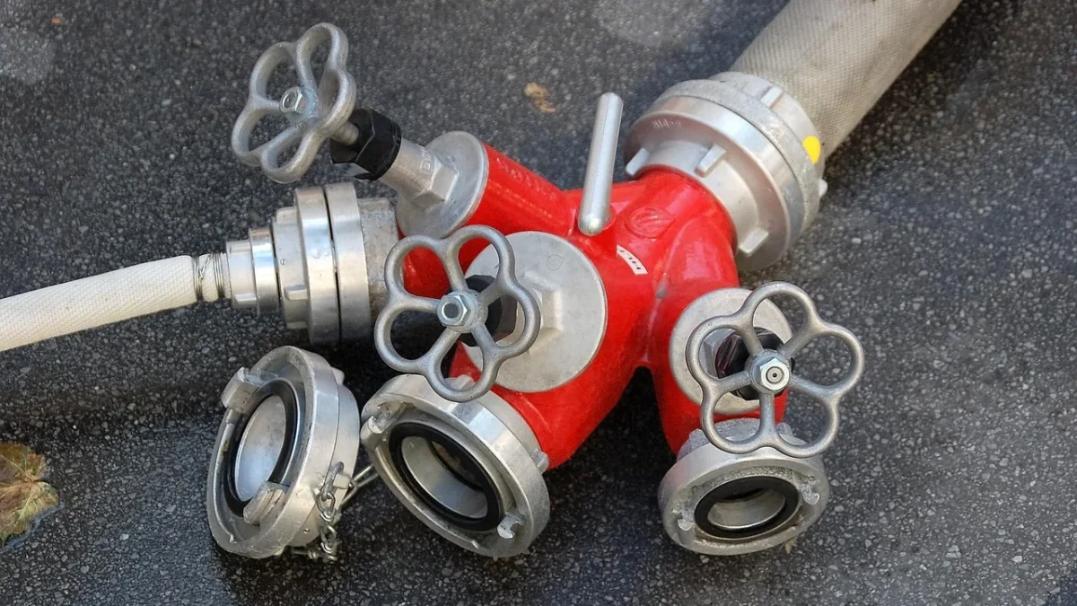 Close-up of a drip emitter clogged with mineral buildup next to a clear working emitter