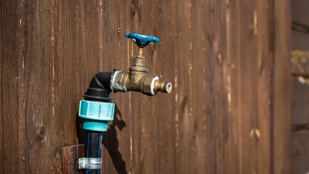 Drip irrigation pressure regulator and filter connected at a garden faucet
